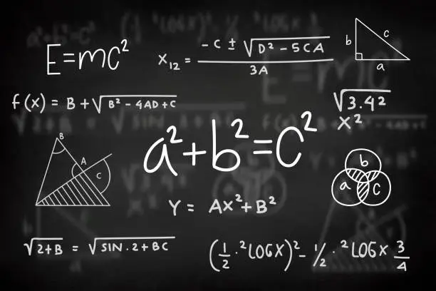 Mathematical formula on a black chalkboard. Calculation and Equation.