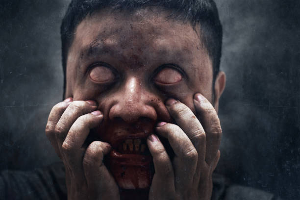 istock Man possessed on dark background, exorcist 1414950112