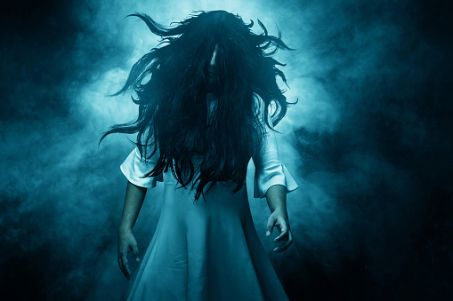 Scary ghost woman on dark background