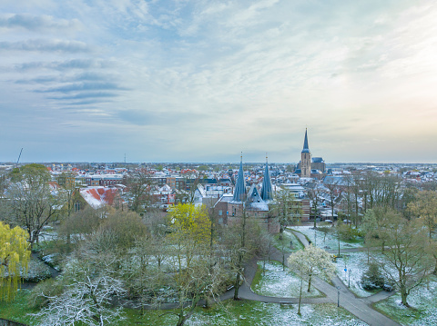 Cold early springtime morning in Kampen seen from above with the Bovenkerk in the center and the river IJssel flowing in the background in Overijssel, Netherlands..