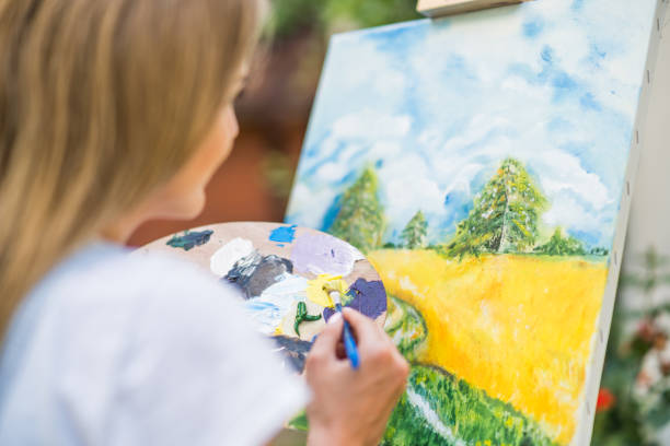 istock Woman  painting 1414952414