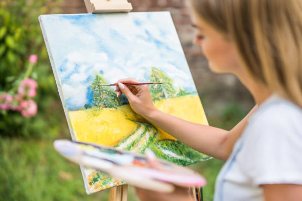 istock Woman  painting 1414952494