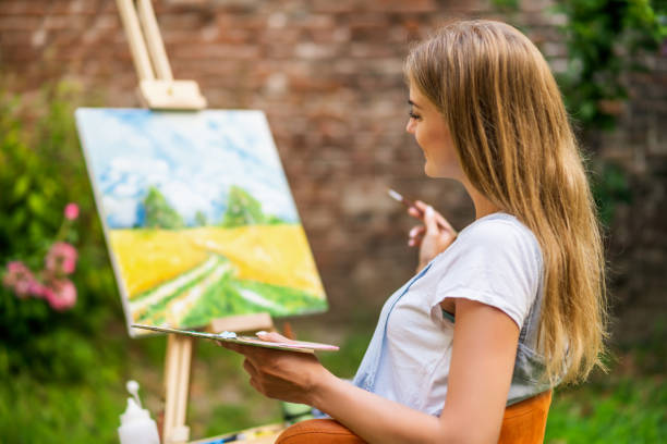 istock Woman  painting 1414952527