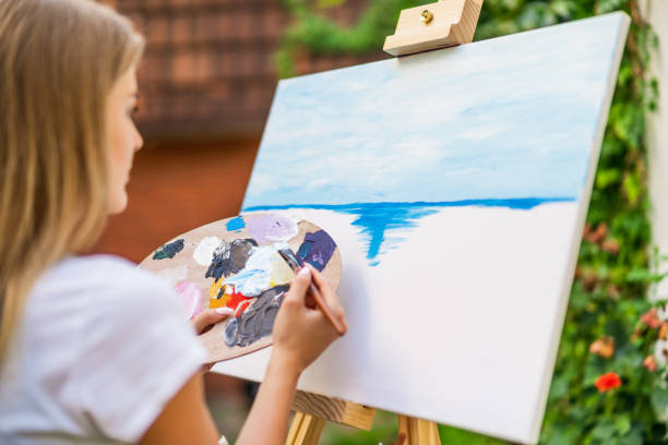 istock Woman  painting 1414952601