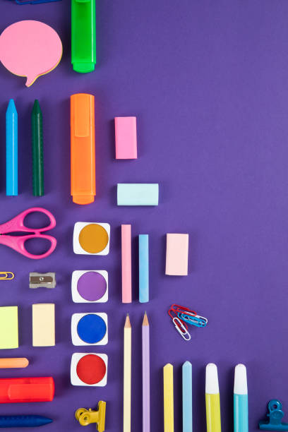 istock School Supplies on Purple Background 1414952663