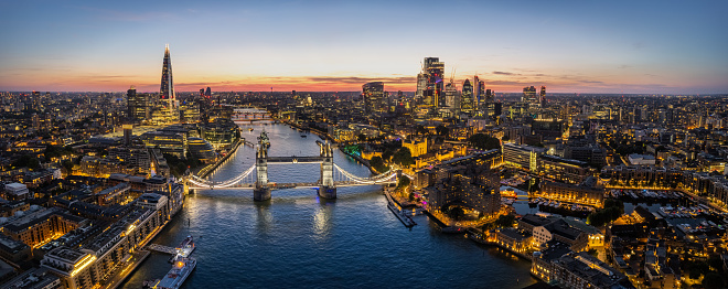 Panoramic aerial view of river Thames and London Tower Bridge at Twilight in blue hour