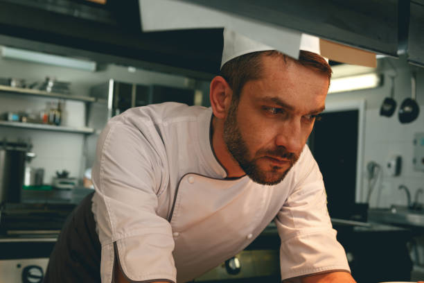 istock Tired chef on kitchen restaurant waiting for a new order 1414955534