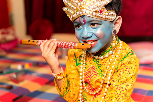 Happy little Indian boys dressed up as Krishna for the Janmashtami celebration.