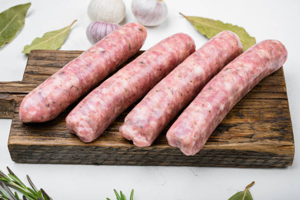 Raw sausage ingredients, on white stone table background