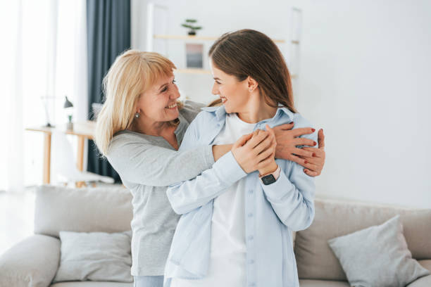 istock Posing for a camera. Mother and daughter is together at home 1414960470