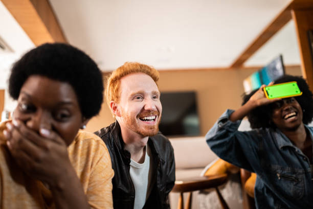 istock Friends playing guessing game at home 1414962181