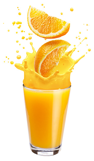 Fresh orange juice pouring into a glass in summer