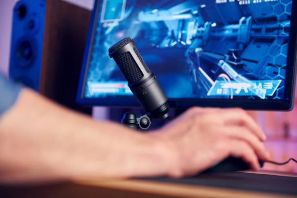 istock Close up view. Online streamer playing FPS shooter game at home 1414962477