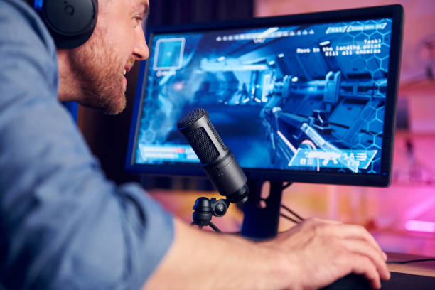 istock Close up view. Online streamer playing FPS shooter game at home 1414962492