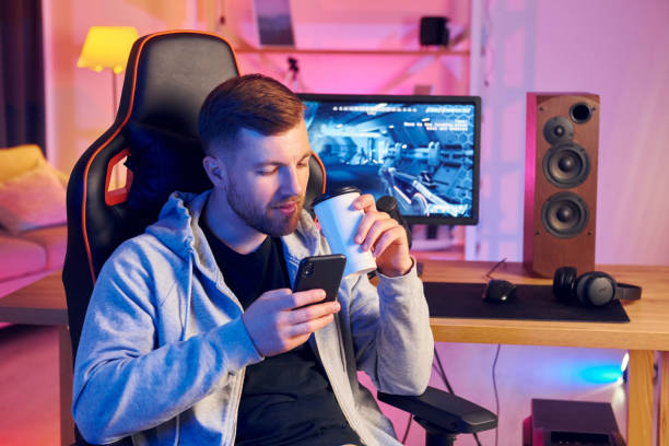 istock Taking a break. Online streamer playing FPS shooter game at home 1414962529
