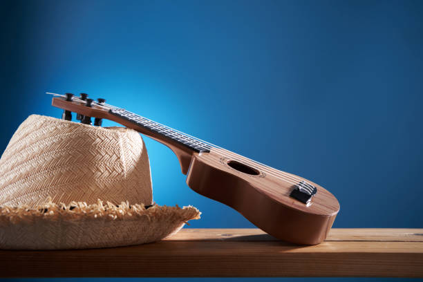 Mexican composition with copy space. Guitar and sombrero hat on blue background. Stereotypical attributes of Mexican culture. Celebrating Cinco de Mayo