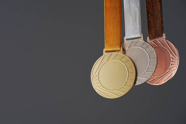 istock real Gold, silver and bronze medals  isolated on gray background. 1414963767