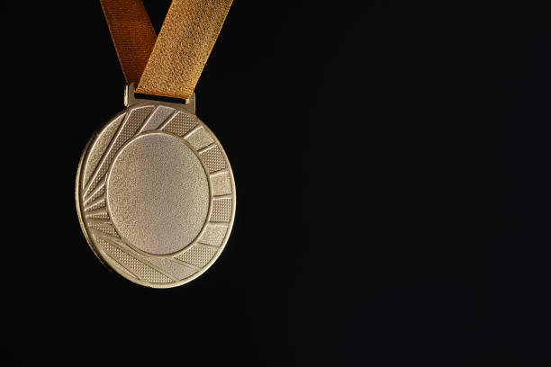istock gold color medal with copy space against black background 1414963789