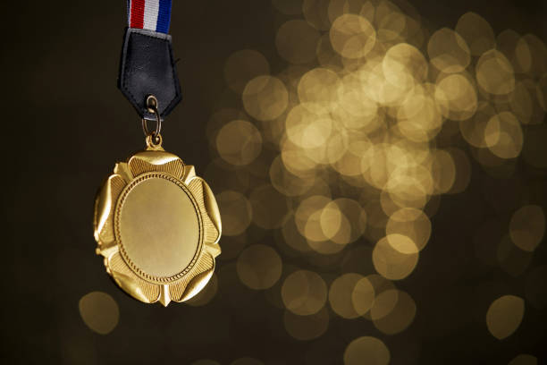 istock gold medal with bokeh background 1414963802