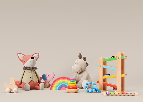 Children's toys on beige background with copy space. Multicolored wooden and plush toys for toddler or baby. Eco friendly toy, plastic free. Empty space for your text, advertising, 3d rendering