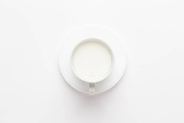 istock cup of milk on white 1414964123