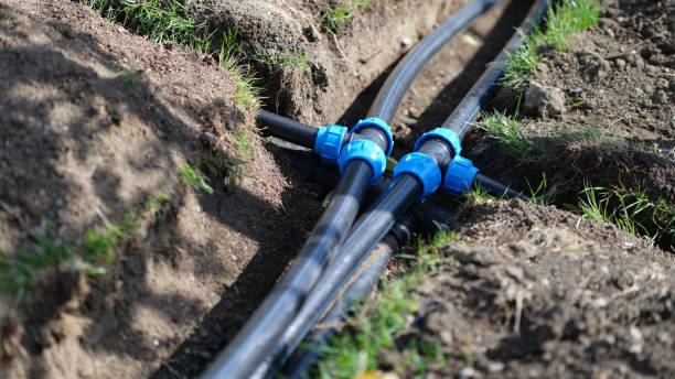 Installed PVC water pipes in trench at summer cottage Installed PVC water pipes in trench at summer cottage. Plumbing system outside home concept sewer drain stock pictures, royalty-free photos & images