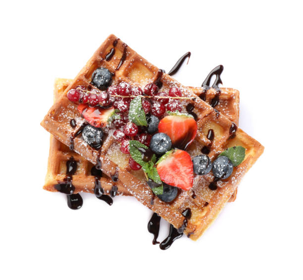 istock Delicious Belgian waffles with berries on white background, top view 1414967418