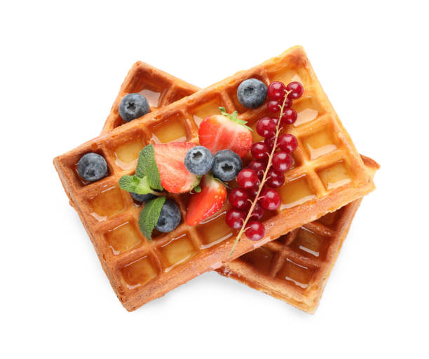 istock Delicious Belgian waffles with berries on white background, top view 1414967430