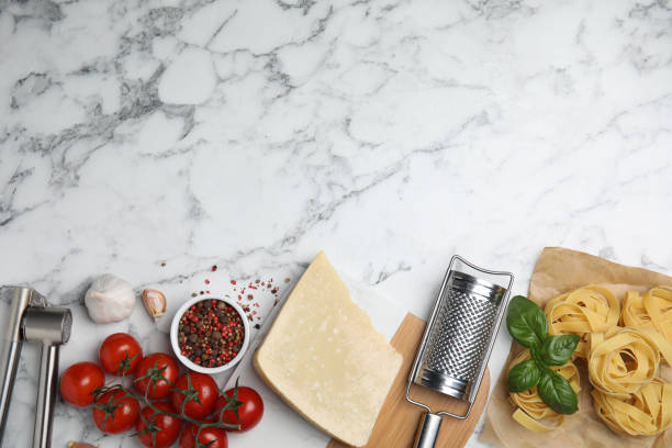 istock Flat lay composition with cooking utensils and fresh ingredients on white marble table. Space for text 1414968156