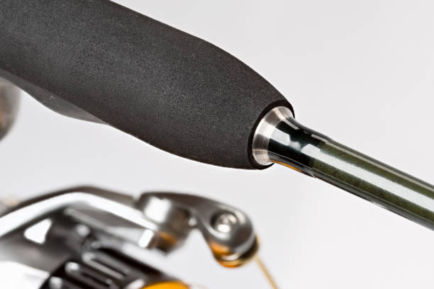 istock Spinning reel with fishing line on a white background. 1414968340