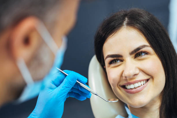 istock Young woman during a dental check-up 1414968594