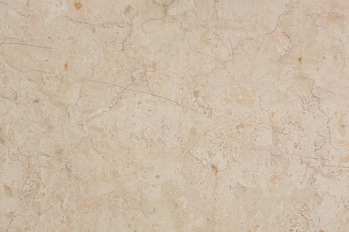 Crema Marfil Marble background in beige color. High resolution photo.