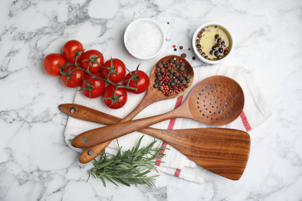 istock Flat lay composition with cooking utensils and fresh ingredients on white marble table 1414968983