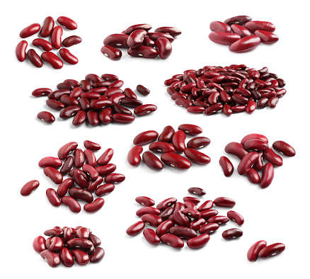 Set with raw red kidney beans on white background