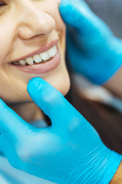 Dentist check up - examining patients mouth and teeth stock photo