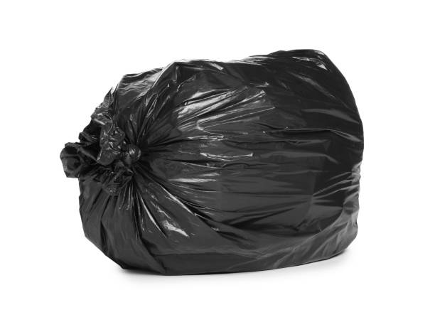 istock Black trash bag filled with garbage isolated on white 1414971274