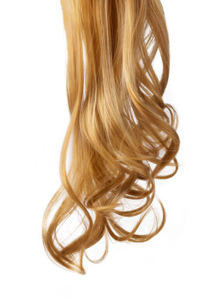 istock Long golden blond curly hair isolated on white background. 1414971344