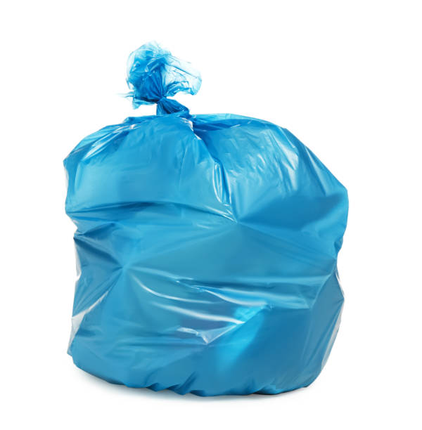 istock Blue trash bag filled with garbage isolated on white 1414971563
