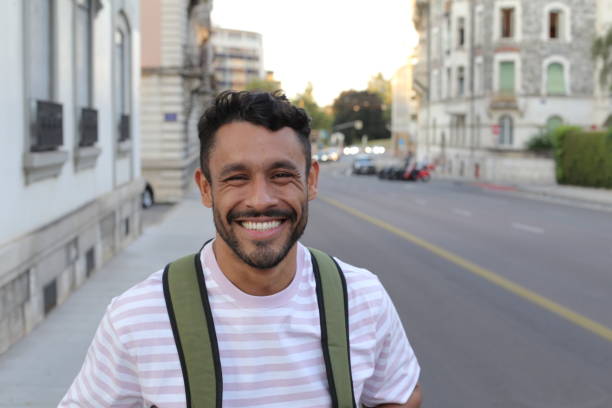istock Handsome adult man with backpack 1414972899