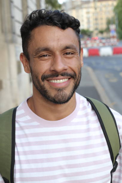 istock Handsome adult man with backpack 1414973160