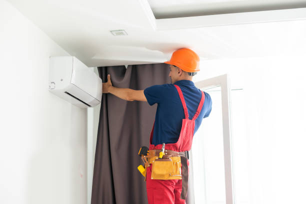 istock man doing house works, attach the railing and hang curtains at home. 1414973343