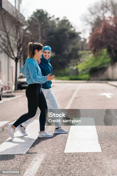 Runners In Zebra Crossing Stock Photo - Download Image Now - Walking, Women, Exercising