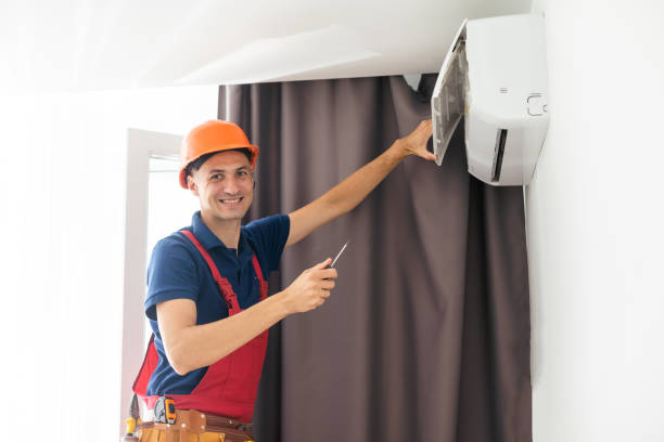 istock Technician repairing air conditioner on the wall. 1414976296