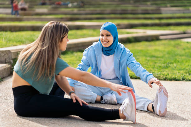 istock Runner Friends Stretching in the Park 1414976495
