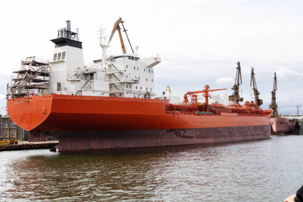 istock oil tanker unloading big ship in shipyard 1414978599