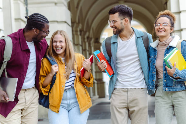 istock Multi-ethnic group of University students hanging out after class 1414980315