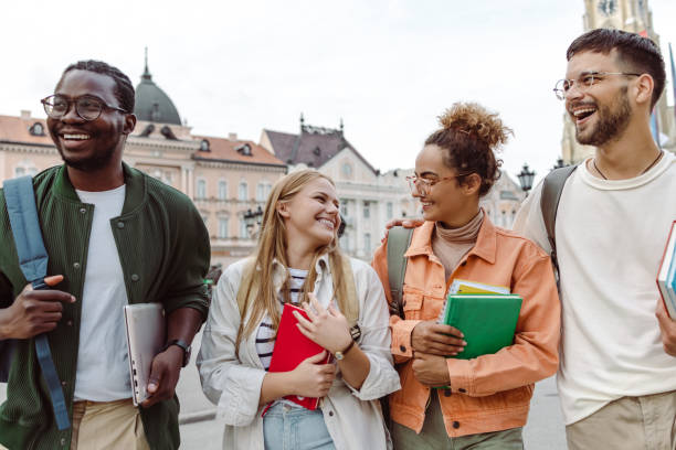 istock Multi-ethnic group of students hanging out after class 1414981193