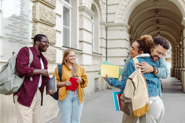 istock Cheerful students celebrating good results 1414981633