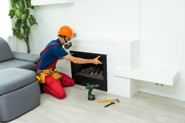 istock Service technician working on a fireplace inside of a residential home 1414982157