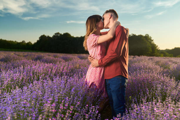 istock Young couple in a lavender field at sunset 1414983984